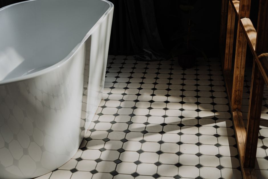 Professional installing bathroom floor tiles